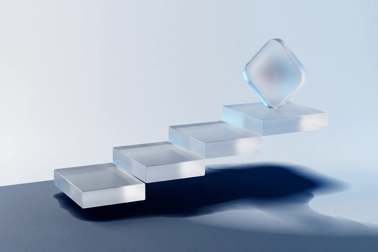 Frosted glass steps rising left to right on pale grey with a rounded frosted tile resting on the top step, navy shadow below.