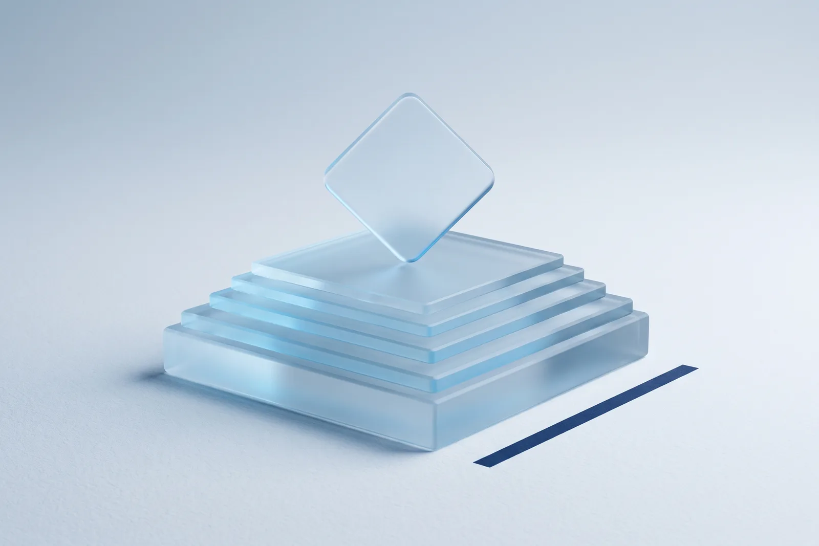 Frosted glass slabs stacked in graduated sizes with a rounded frosted tile standing on its point on top, a navy bar beside.