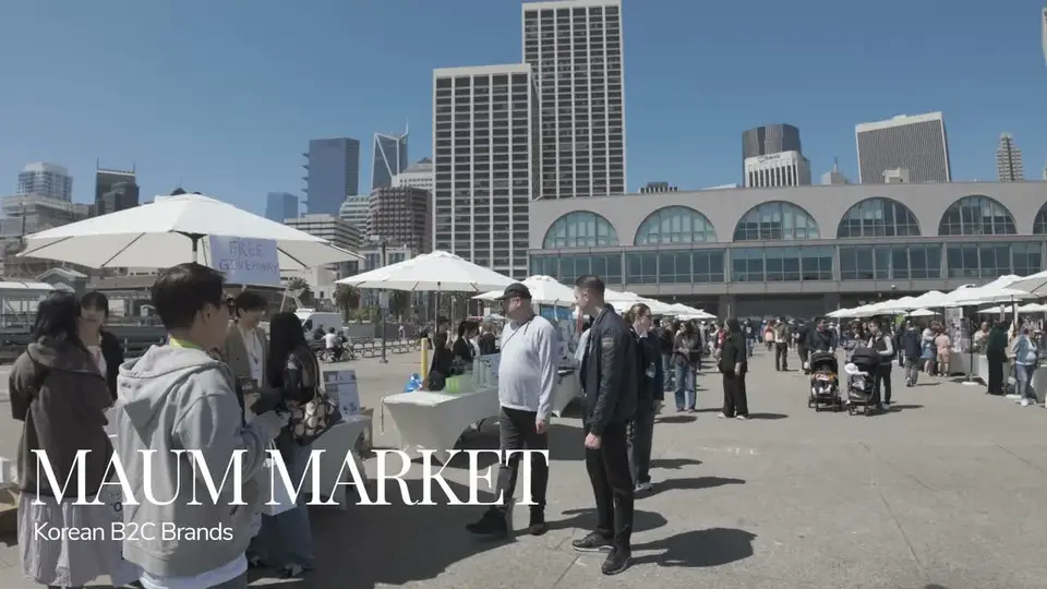 Visitors and market stalls outside San Francisco's Ferry Building in Dahna's original May 2026 recap footage.