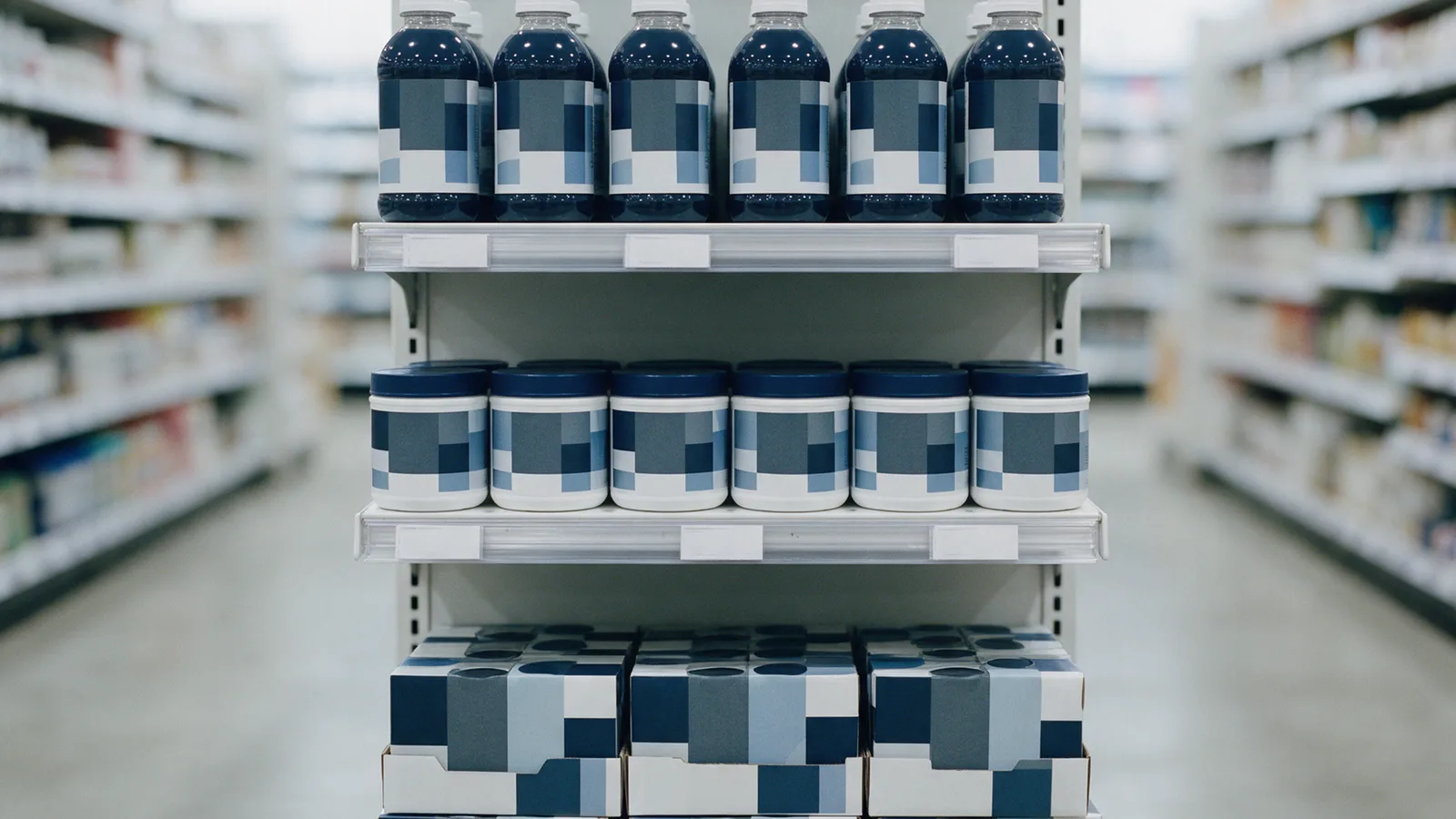 A store endcap with a blank header: bottled drinks and tubs in six facings at eye level, boxed multipacks on the base deck.